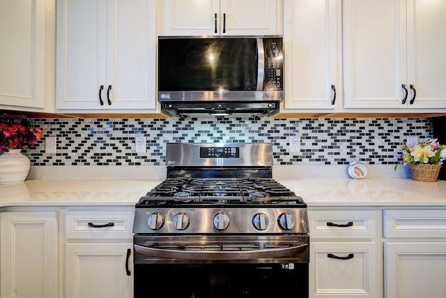 kitchen featuring white cabinetry, light countertops, tasteful backsplash, and stainless steel appliances