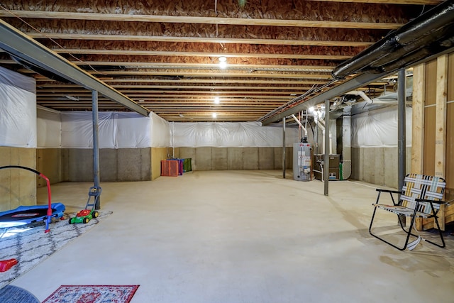 unfinished basement with heating unit and water heater