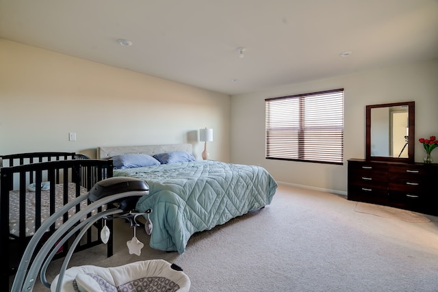 bedroom with carpet and baseboards