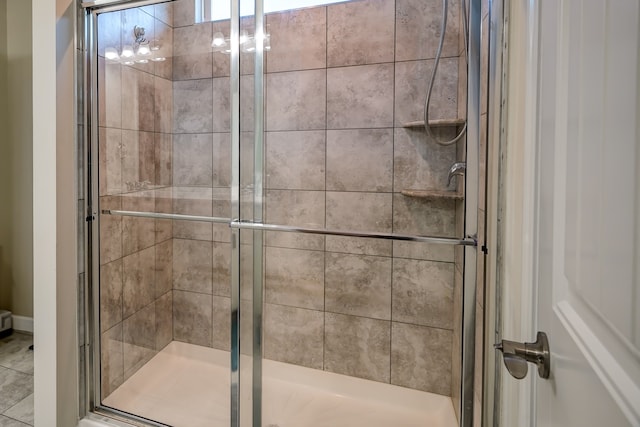 bathroom with a shower stall