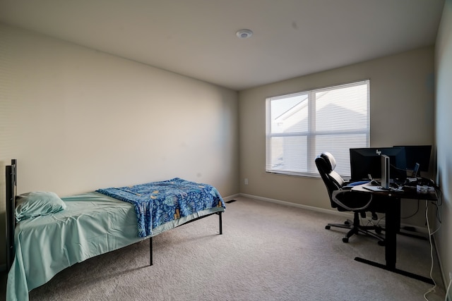 carpeted bedroom with baseboards