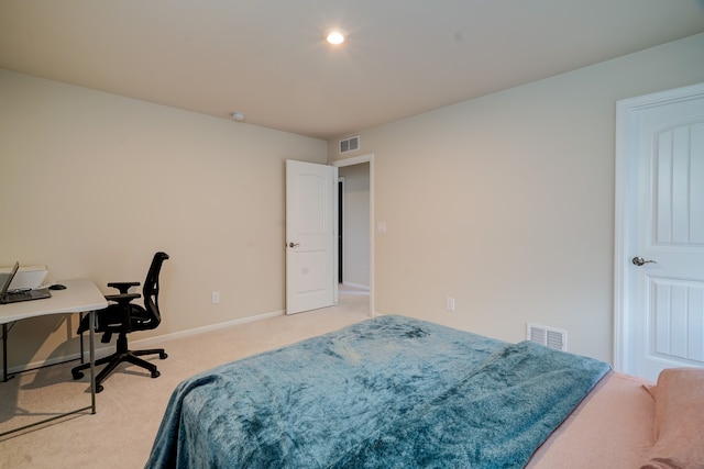 bedroom with light colored carpet, visible vents, and baseboards