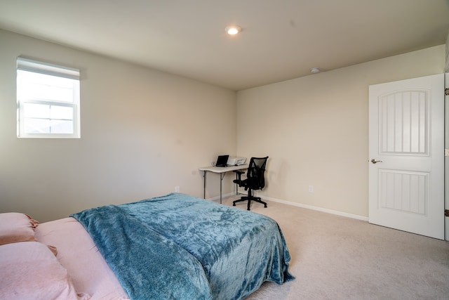 carpeted bedroom with baseboards