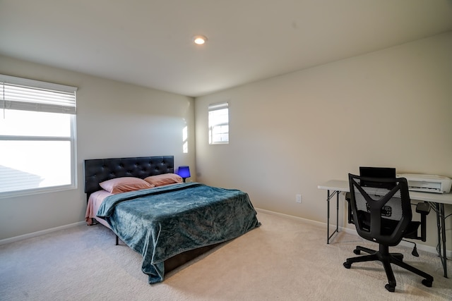 bedroom with recessed lighting, baseboards, and light carpet