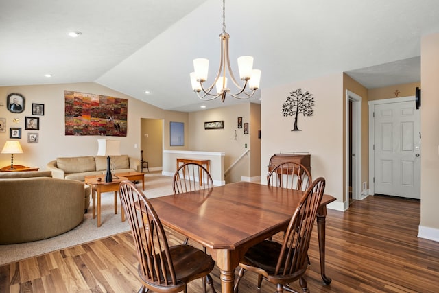 dining space with lofted ceiling, recessed lighting, baseboards, and wood finished floors