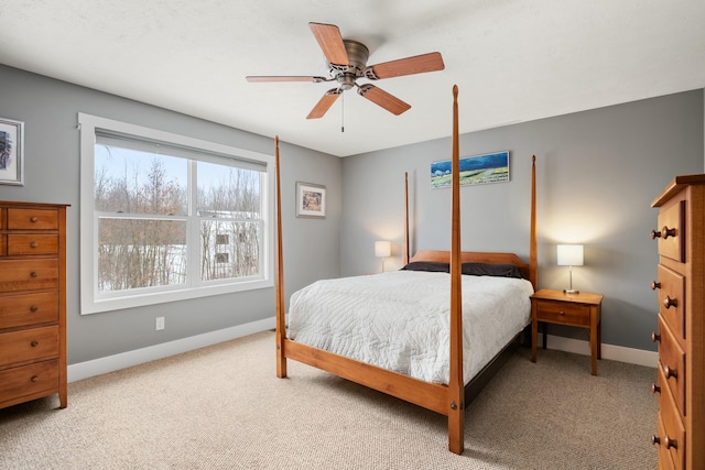 bedroom with carpet flooring, a ceiling fan, and baseboards