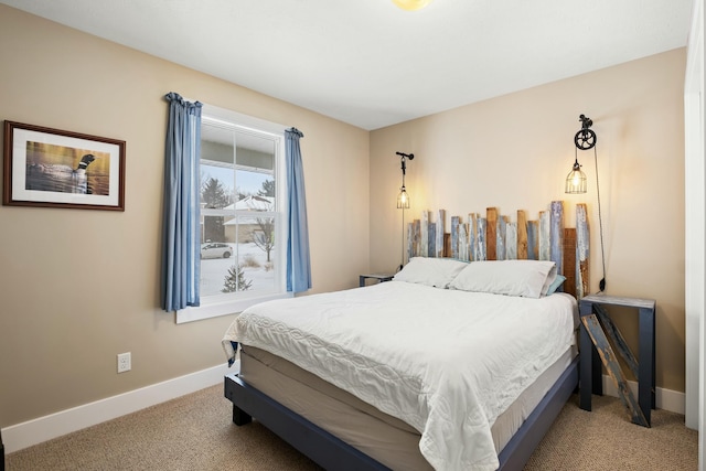 bedroom featuring carpet and baseboards