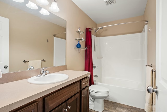 full bath with visible vents, shower / tub combination, vanity, and toilet