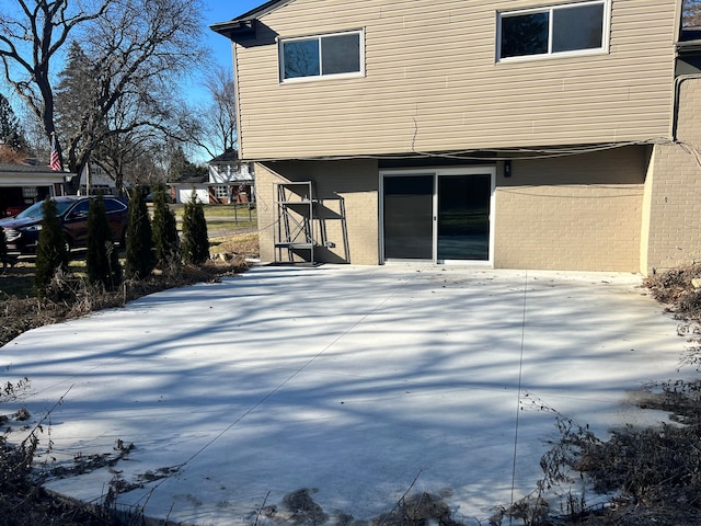 view of side of home featuring brick siding