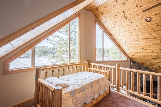 carpeted bedroom featuring lofted ceiling and wood ceiling