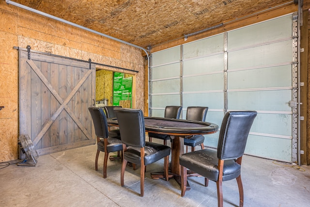 dining room featuring unfinished concrete flooring