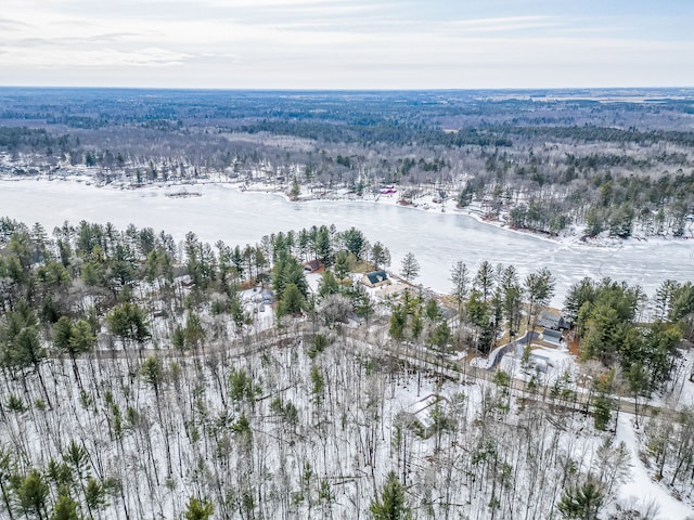 aerial view with a forest view and a water view