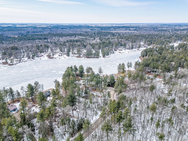 birds eye view of property with a wooded view