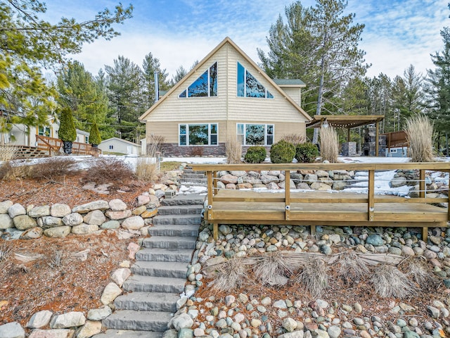 back of house featuring a wooden deck