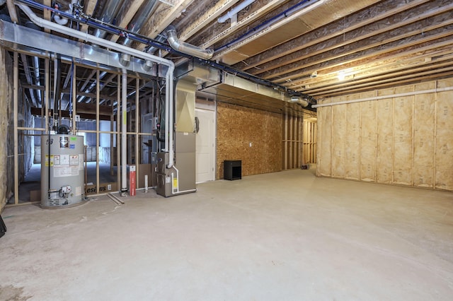 unfinished basement featuring heating unit and water heater