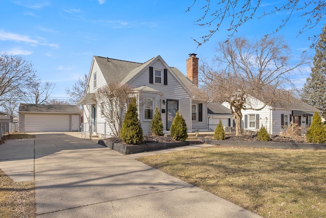 bungalow with roof with shingles, a chimney, a garage, an outdoor structure, and a front lawn