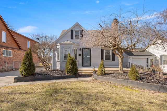 view of front of home featuring a garage and a front lawn