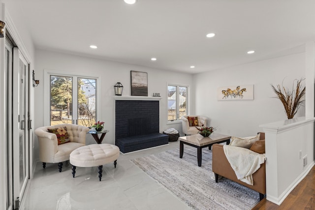 sitting room with recessed lighting, visible vents, and a fireplace