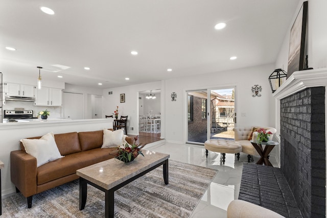 living room featuring recessed lighting and baseboards