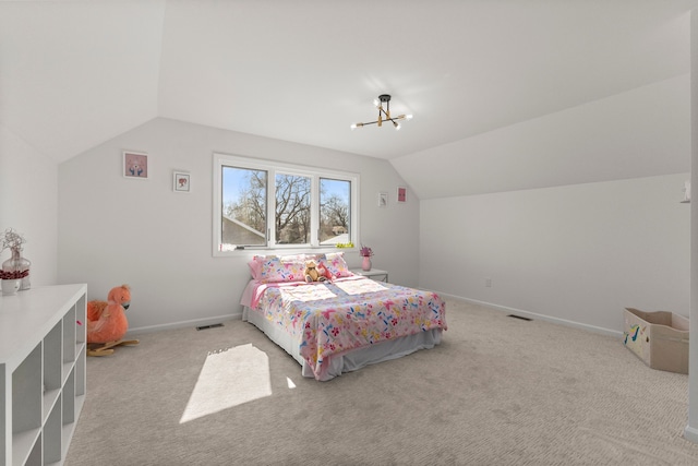 bedroom featuring light carpet, visible vents, baseboards, and vaulted ceiling