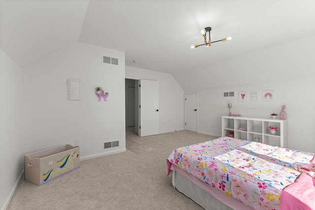 bedroom featuring vaulted ceiling, carpet, and visible vents