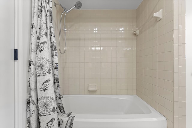 bathroom with shower / bath combination with curtain