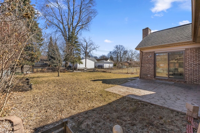 view of yard featuring a patio and a fenced backyard