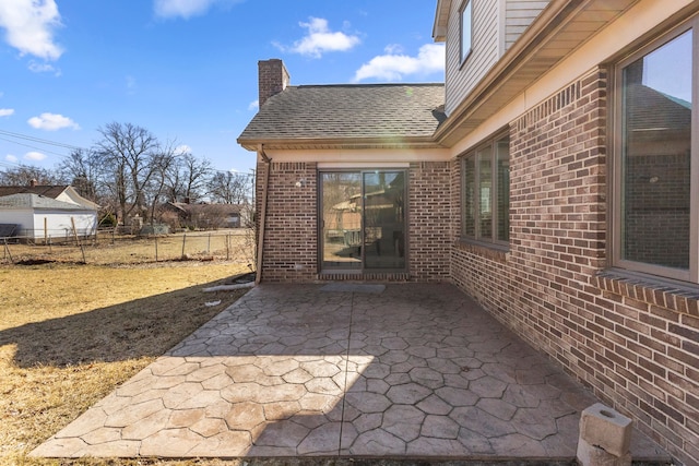 view of patio featuring fence