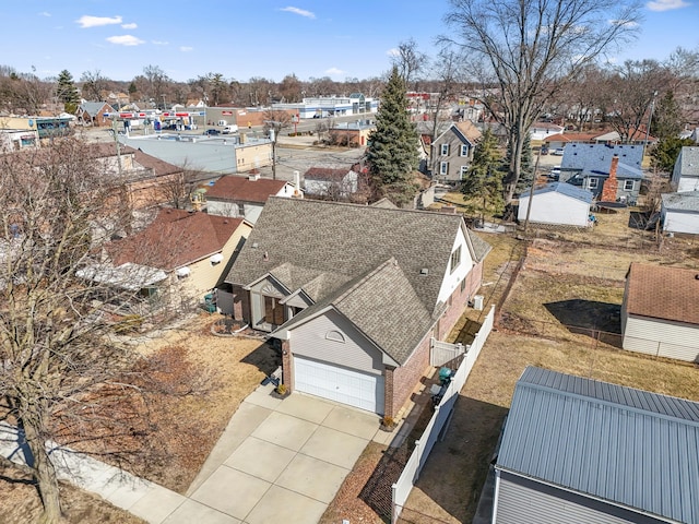 birds eye view of property with a residential view