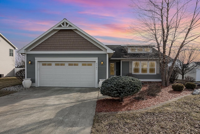 view of front facade featuring an attached garage and concrete driveway