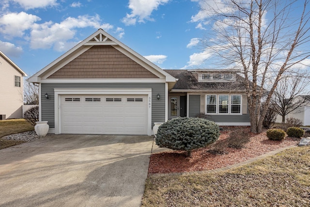 view of front of property featuring a garage and driveway