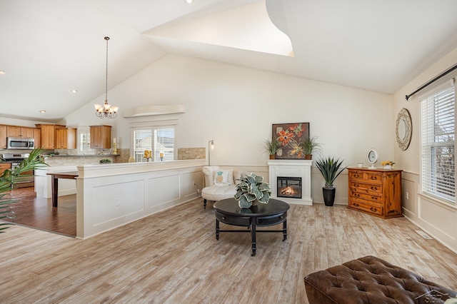 interior space with stainless steel appliances, light countertops, a wealth of natural light, and light wood-style floors