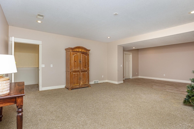 unfurnished room featuring light carpet, recessed lighting, and baseboards