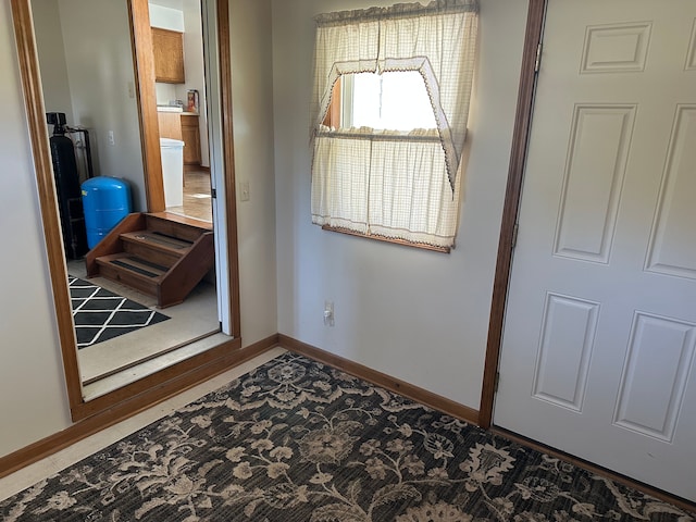 interior space featuring baseboards