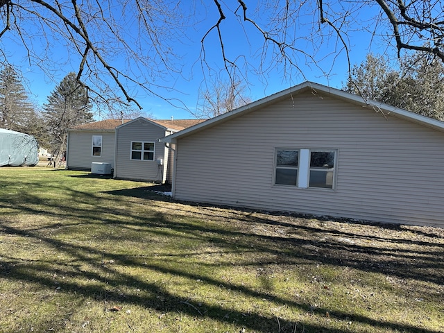 rear view of house with a lawn