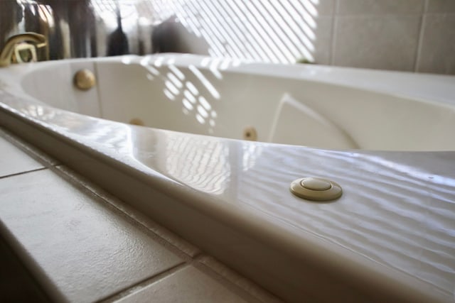 interior details featuring a whirlpool tub