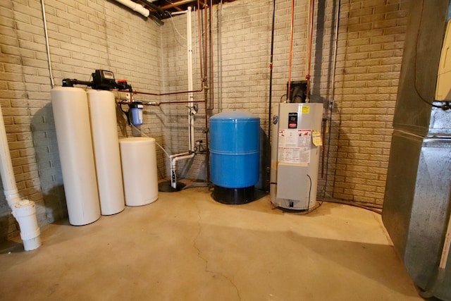 utility room featuring water heater