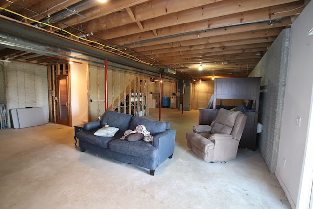 unfinished basement featuring stairway