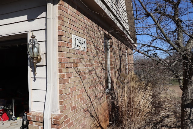 view of home's exterior with brick siding