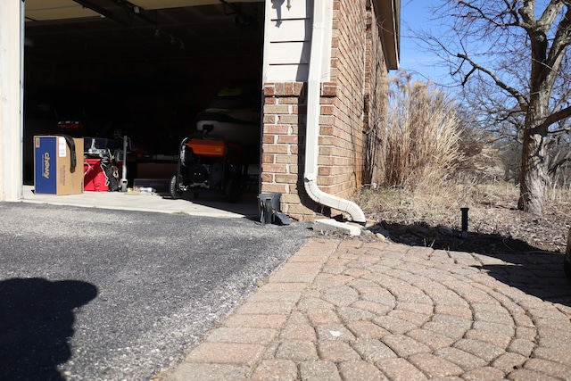 exterior space featuring brick siding