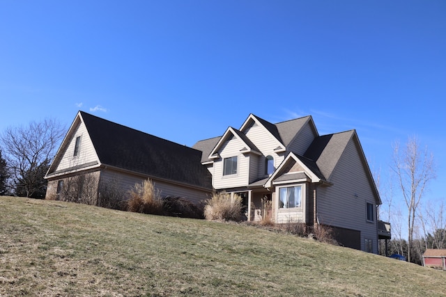 view of front of property with a garage and a front yard