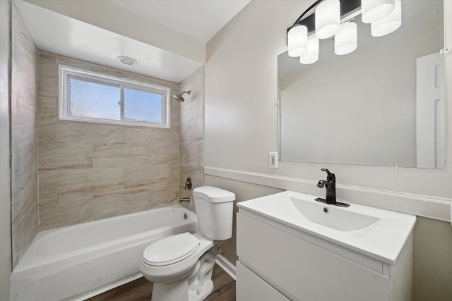 full bathroom featuring tub / shower combination, vanity, toilet, and wood finished floors