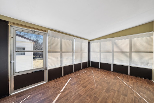 unfurnished sunroom featuring lofted ceiling