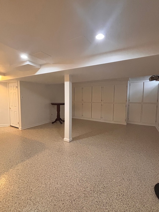 finished basement with recessed lighting and baseboards