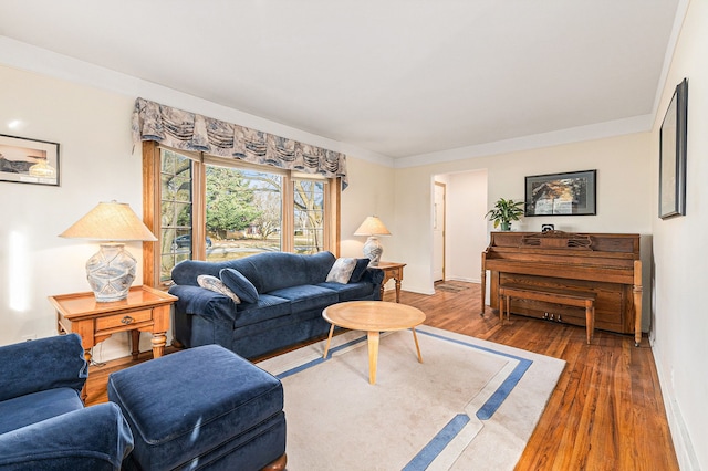 living room featuring baseboards and wood finished floors