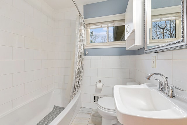 full bath with shower / bathtub combination with curtain, visible vents, a sink, tile walls, and toilet