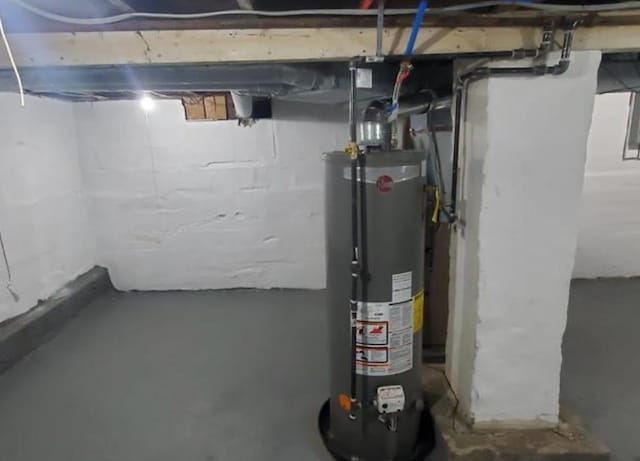 utility room featuring gas water heater