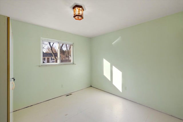 spare room with visible vents and concrete floors