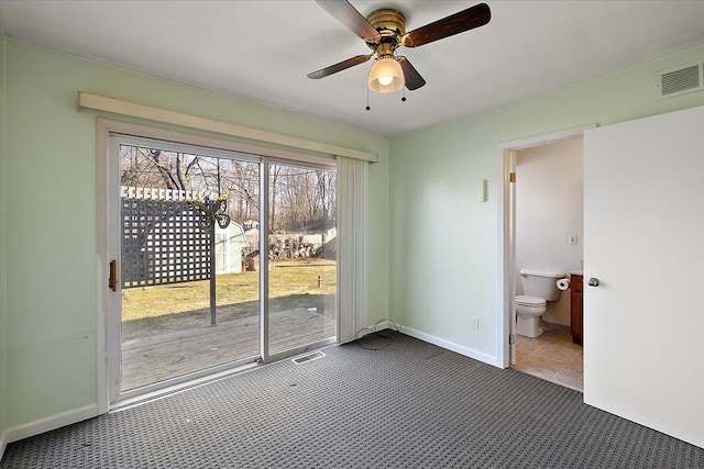 doorway to outside with visible vents, baseboards, carpet, and a ceiling fan