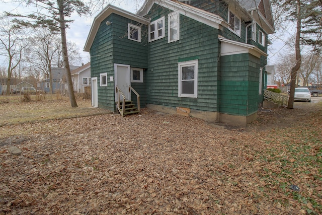 rear view of house with entry steps